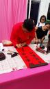 Calligraphers will write your name in Chinese for a small fee
